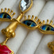 ARETES ROSTRO COLGANTES