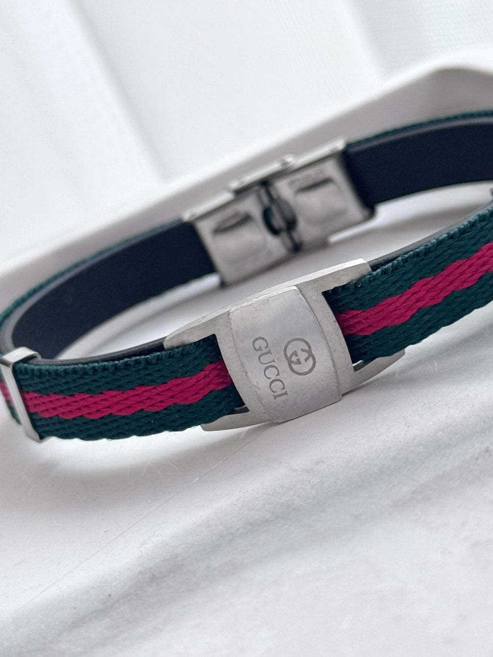PULSERA TELA GG A LATEADA