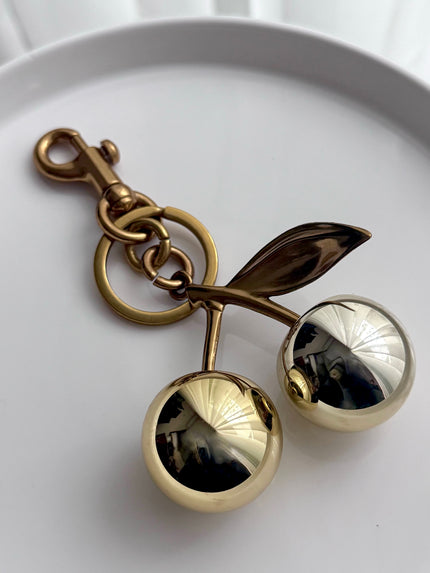 LLAVERO CEREZA DORADO