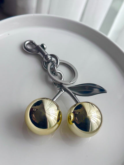 LLAVERO DORADO Y PLATEADO