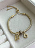PULSERA CON CHARMS
