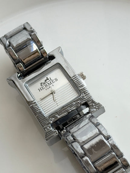 RELOJ H