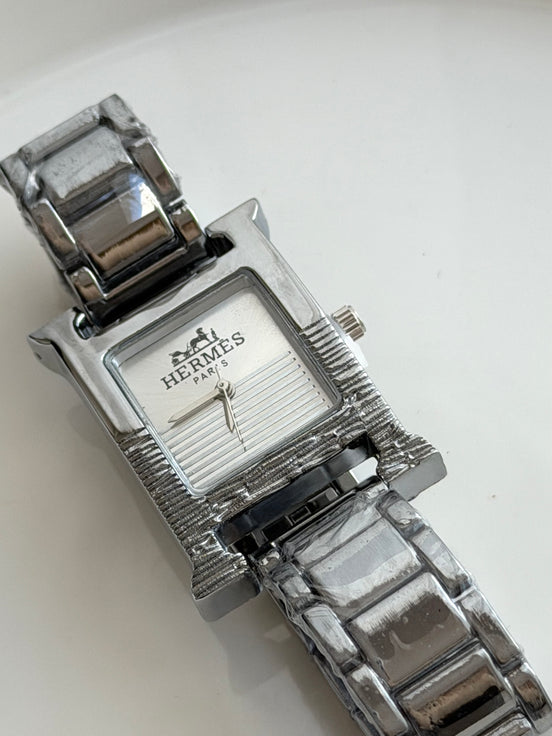 RELOJ H