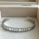 BRAZALETE ABIERTO LETRAS TOUS