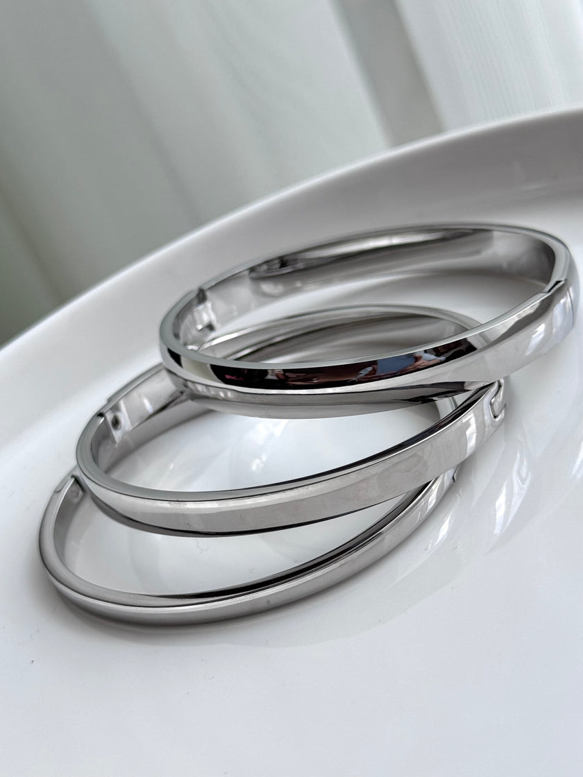 TRÍO DE BRAZALETES PLATEADO