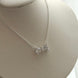 COLLAR MOÑO CRISTAL BLACO