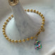 PULSERA BOLITAS CON OSO