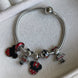 PULSERA CON CHARMS