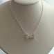 COLLAR MOÑO CRISTAL BLACO