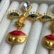 ARETES ROSTRO COLGANTES