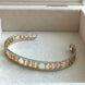 BRAZALETE ABIERTO LETRAS TOUS