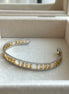 BRAZALETE ABIERTO LETRAS TOUS