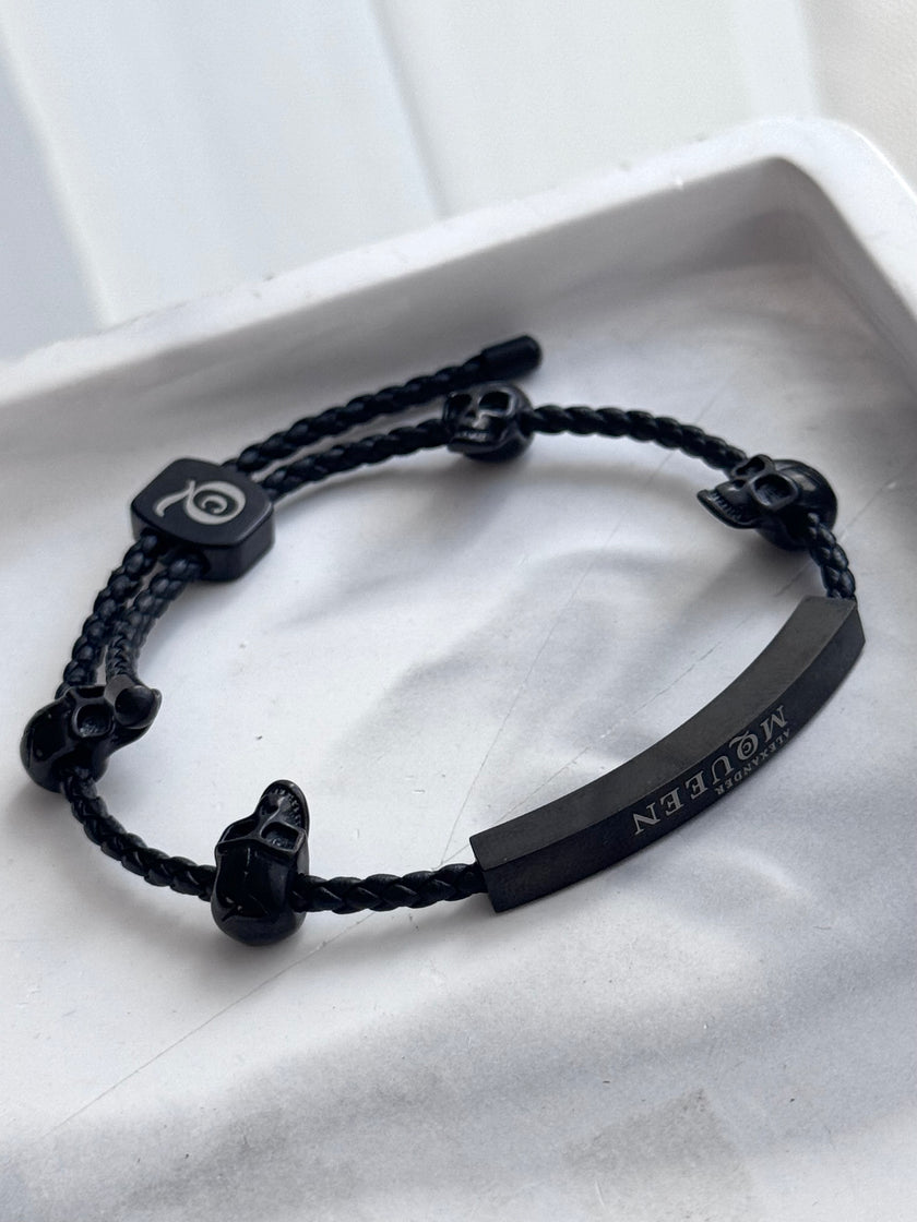 PULSERA TRENZADA CALAVERAS NEGRAS