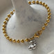PULSERA BOLITAS CON OSO