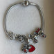 PULSERA CON CHARMS