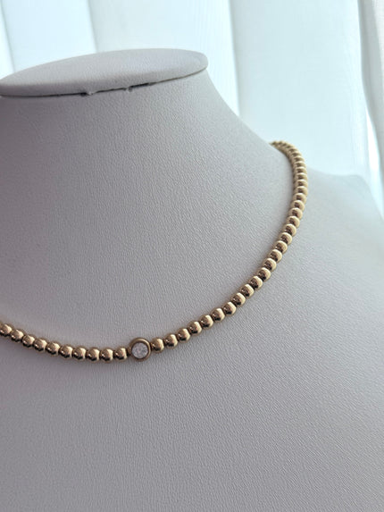 COLLAR BOLITAS CON ZIRCONIA DORADO