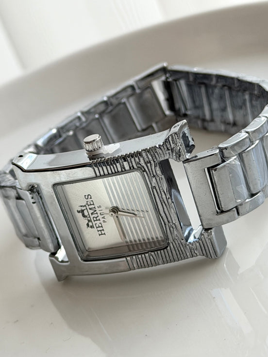 RELOJ H