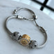 PULSERA CON CHARMS