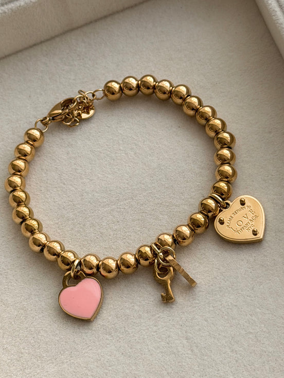 PULSERA BOLITAS CON LLAVE