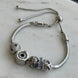 PULSERA CON CHARS