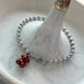 PULSERA BOLITAS CON OSITO