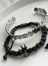 PAR PULSERA CORONA NEGRA