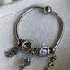 PULSERA CON CHARMS