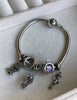PULSERA CON CHARMS
