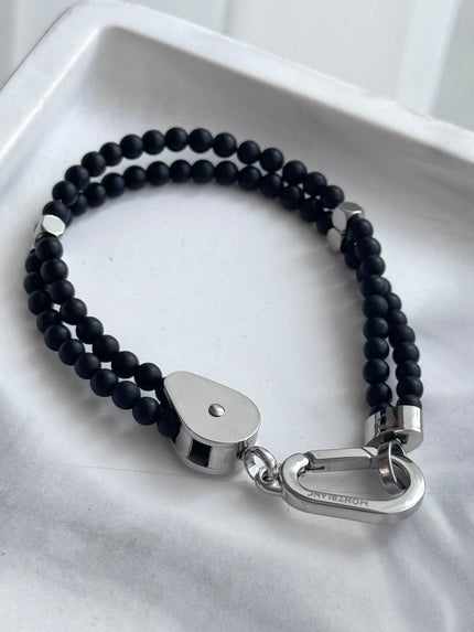 PULSERA BOLITAS NEGRAS