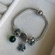 PULSERA CON CHARMS