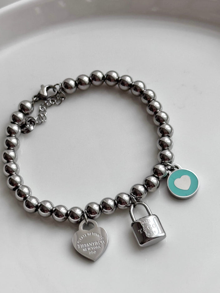 PULSERA BOLITAS CON DIJES