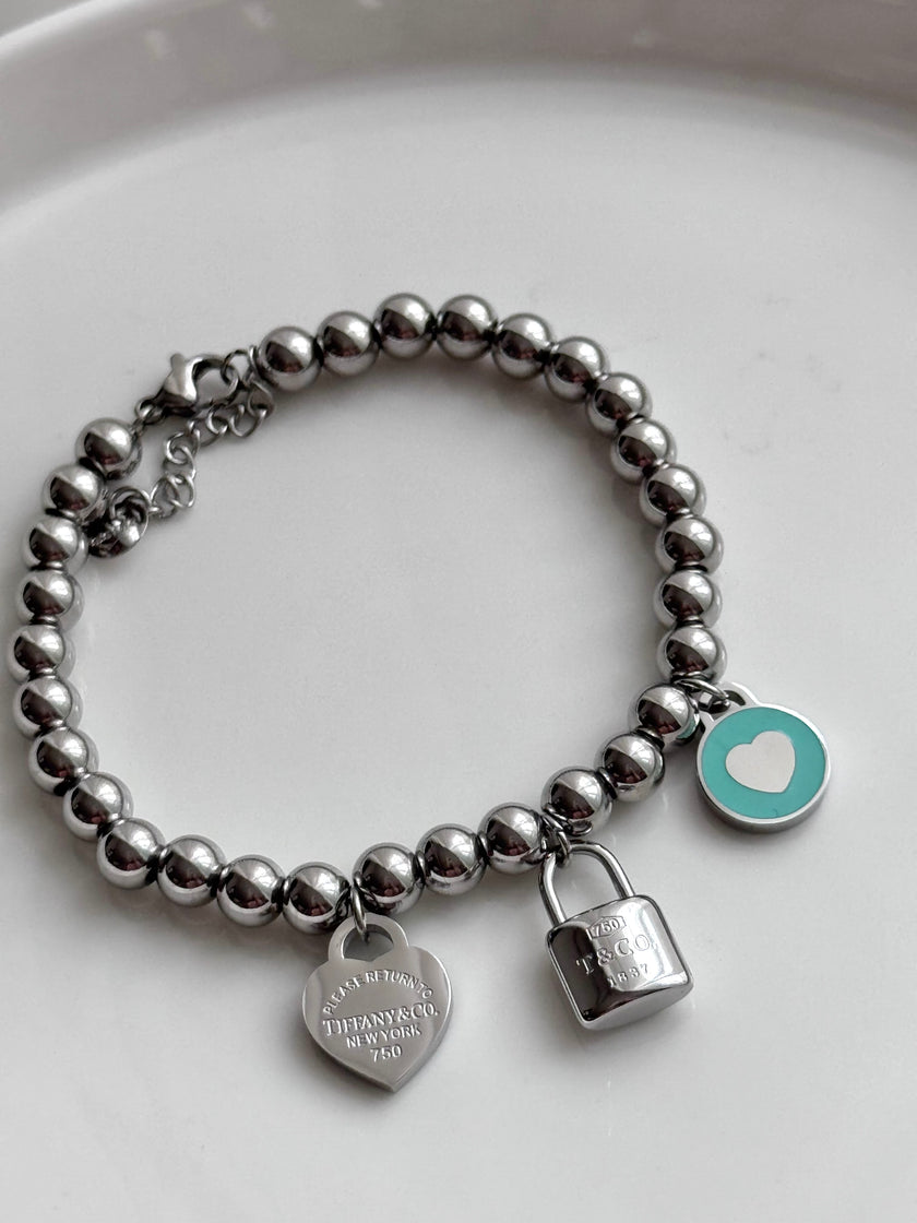 PULSERA BOLITAS CON DIJES