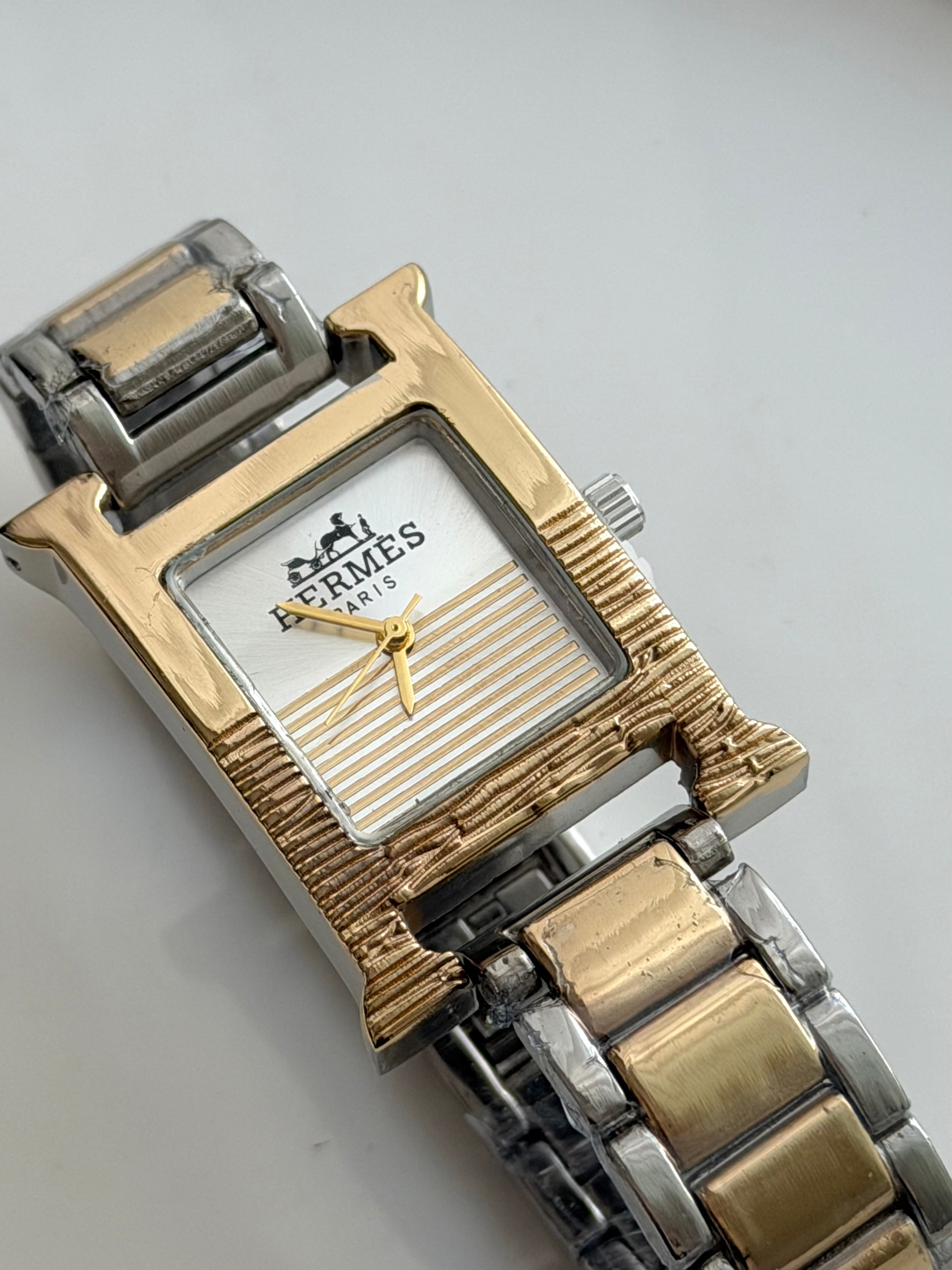 RELOJ H