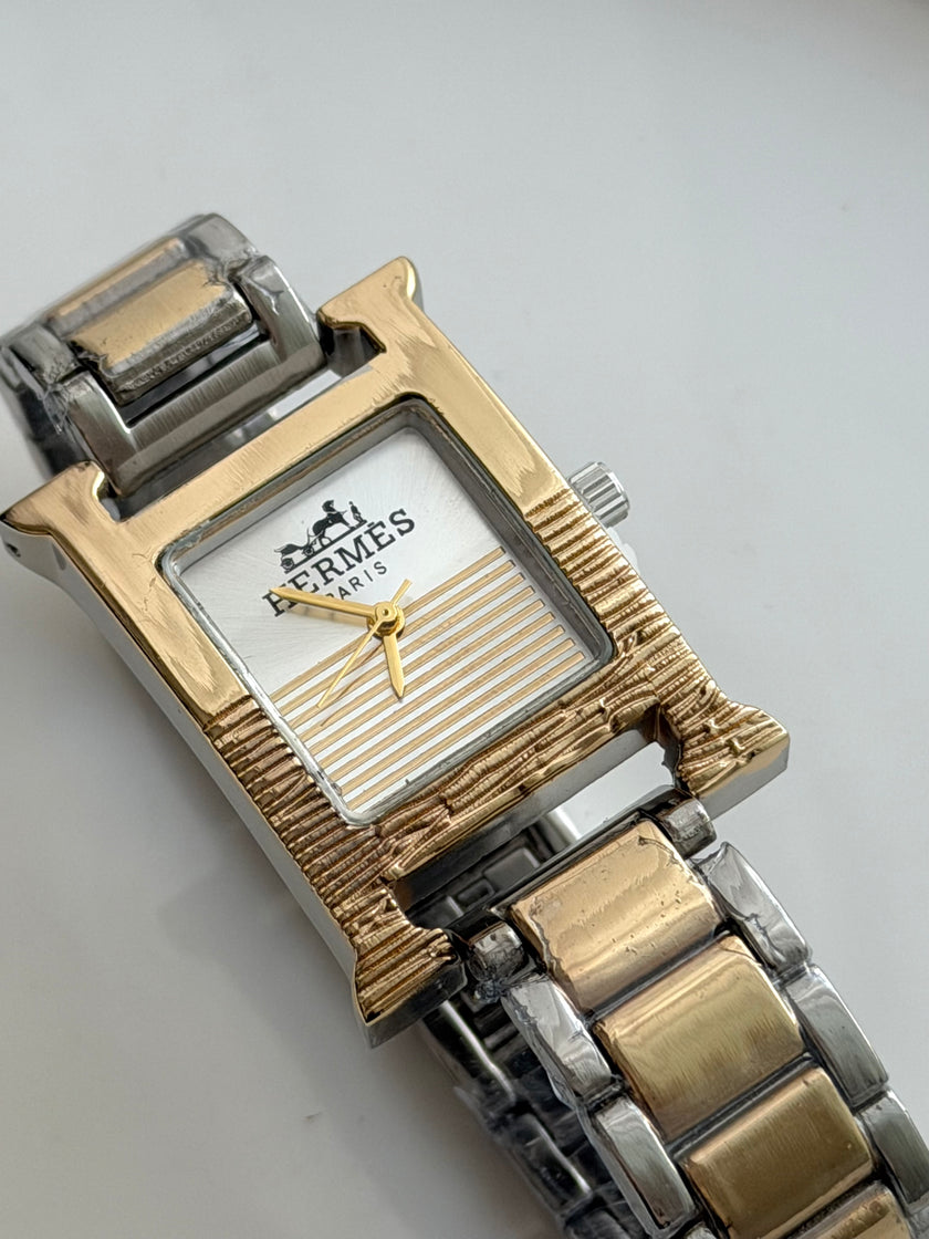RELOJ H