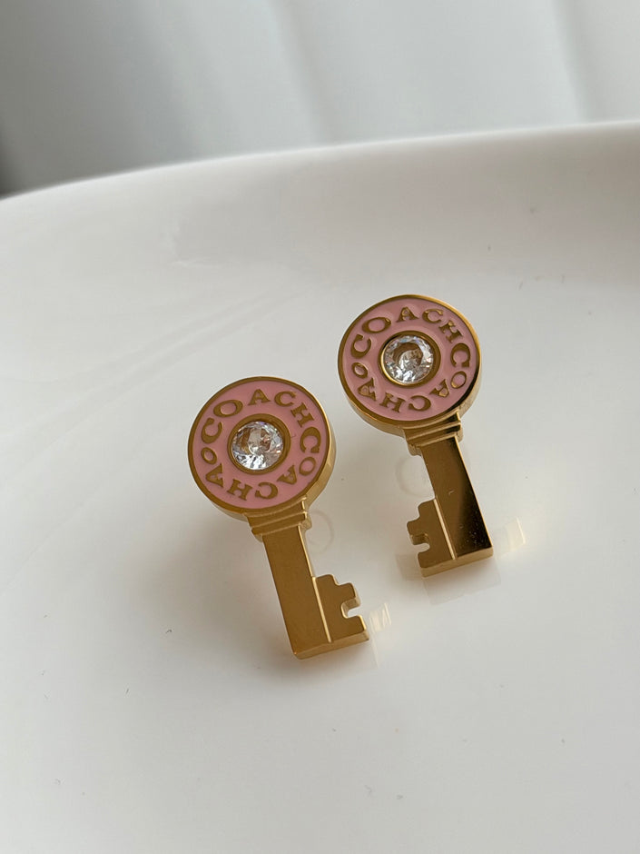 ARETES LLAVE ROSA