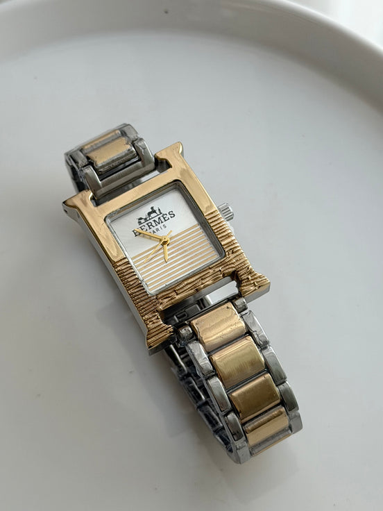 RELOJ H