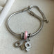 PULSERA CON CHARMS