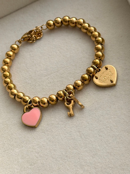 PULSERA BOLITAS CON LLAVE