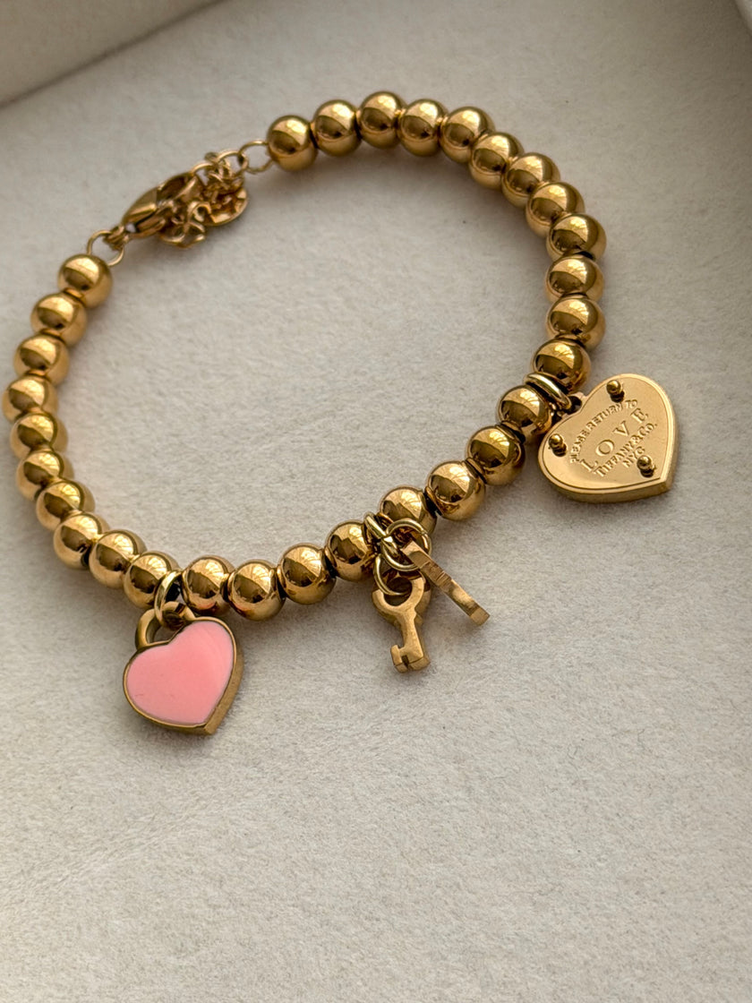 PULSERA BOLITAS CON LLAVE