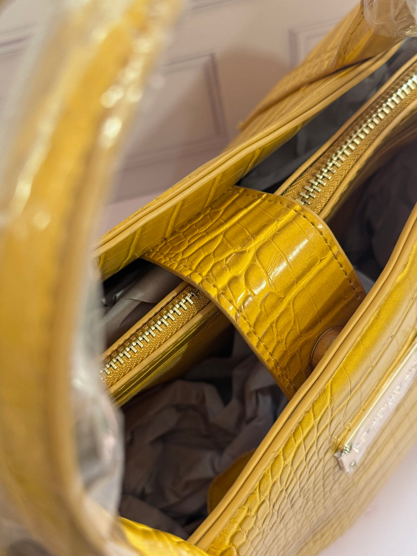 BOLSA BEBE AUBREY CROCO AMARILLA