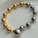 PULSERA BOLITAS BICOLOR