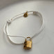 PULSERA HILO CANDADO LV BLANCO