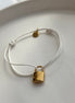 PULSERA HILO CANDADO LV BLANCO