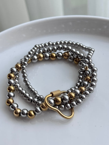 PULSERA BOLITAS HEBILLA CORAZON