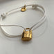 PULSERA HILO CANDADO LV BLANCO