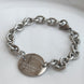 PULSERA TFNY PLACA OVALADA