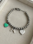 PULSERA BOLITAS CON DIJES