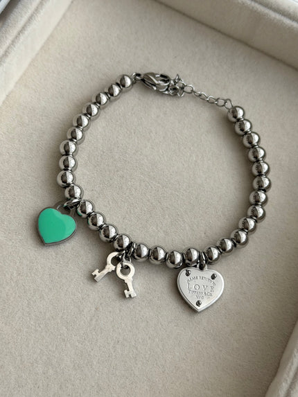 PULSERA BOLITAS CON DIJES
