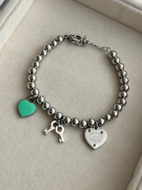 PULSERA BOLITAS CON DIJES