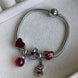 PULSERA CON CHARMS
